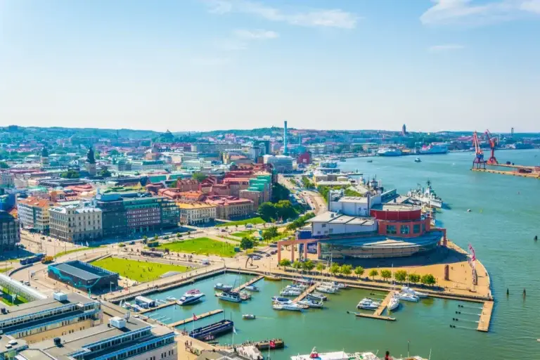 Panoramic view of Gothenburg, Sweden highlighting the vibrant waterfront, bustling cityscape, and lush greenery, ideal for tourists exploring Scandinavia.
