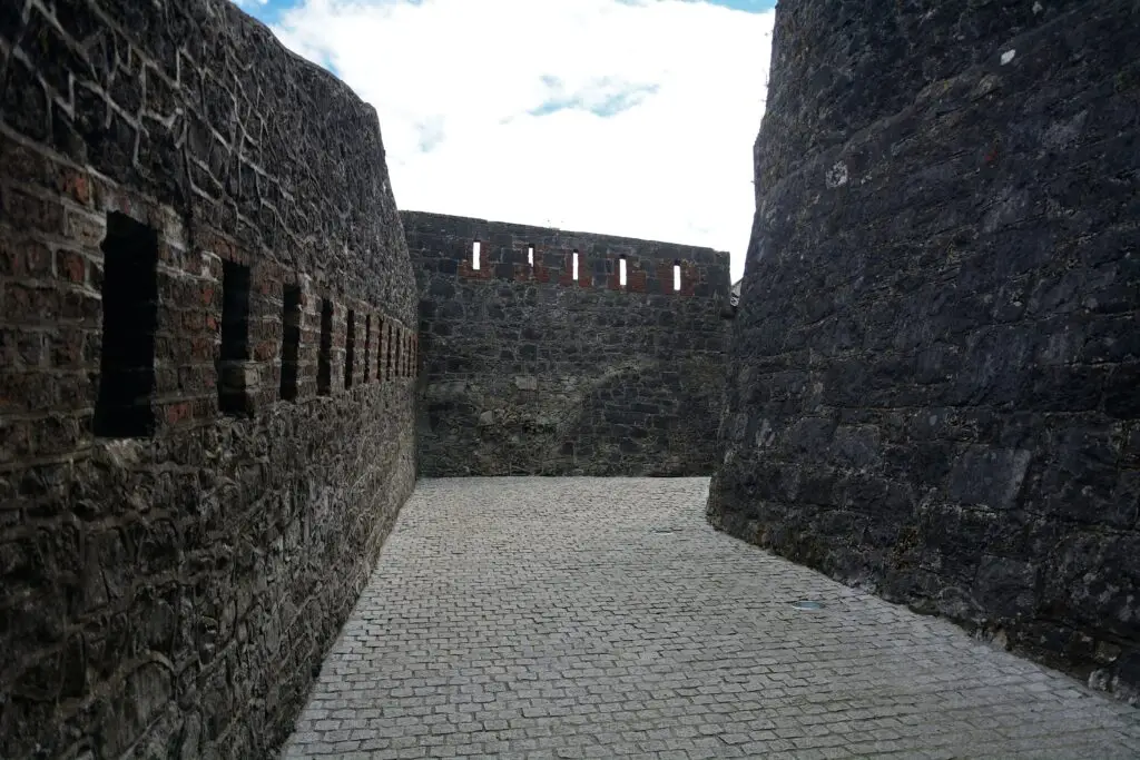 Stone walls and battlements of Athlone Castle in County Westmeath, Ireland, showcasing medieval architecture and historic fortifications for tourists exploring Athlone.