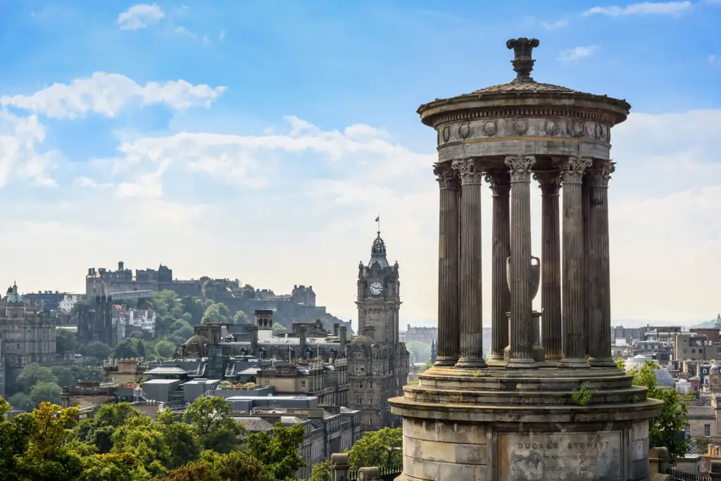 View of Edinburgh city skyline from Calton Hill featuring the Dugald Stewart Monument and Edinburgh Castle, Scotland