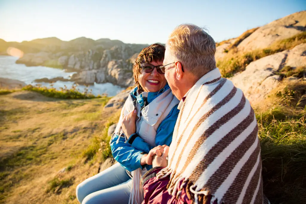 Couple enjoying a scenic coastal view at Lindesnes, Norway during a private guided tour