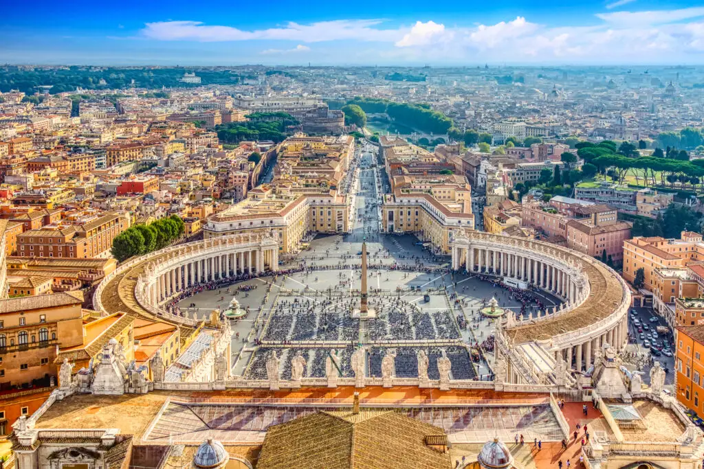Aerial view of Saint Peter’s Square in Vatican City with panoramic view of Rome, Italy, popular European travel and tourism destination on a sunny day