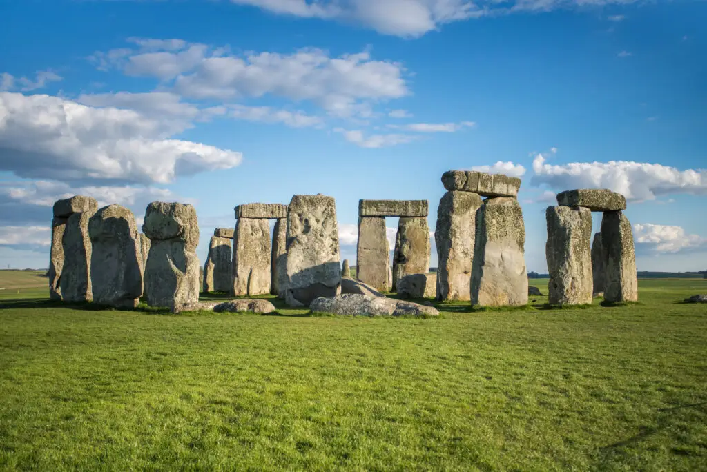 Ancient stone circle of Stonehenge in Wiltshire, England under a blue sky, a famous prehistoric monument and popular tourist attraction in the United Kingdom