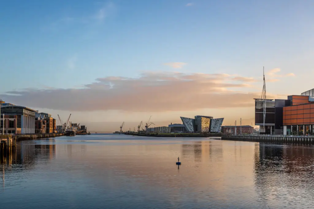 Titanic Belfast museum and waterfront at sunrise in Northern Ireland, popular tourist attraction and landmark for European private tours