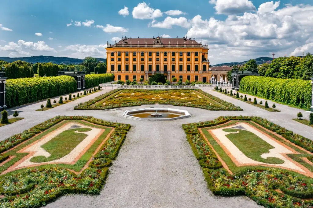 Beautiful view of Schonbrunn Palace and landscaped gardens in Vienna, Austria, a popular European tourist attraction and UNESCO World Heritage site