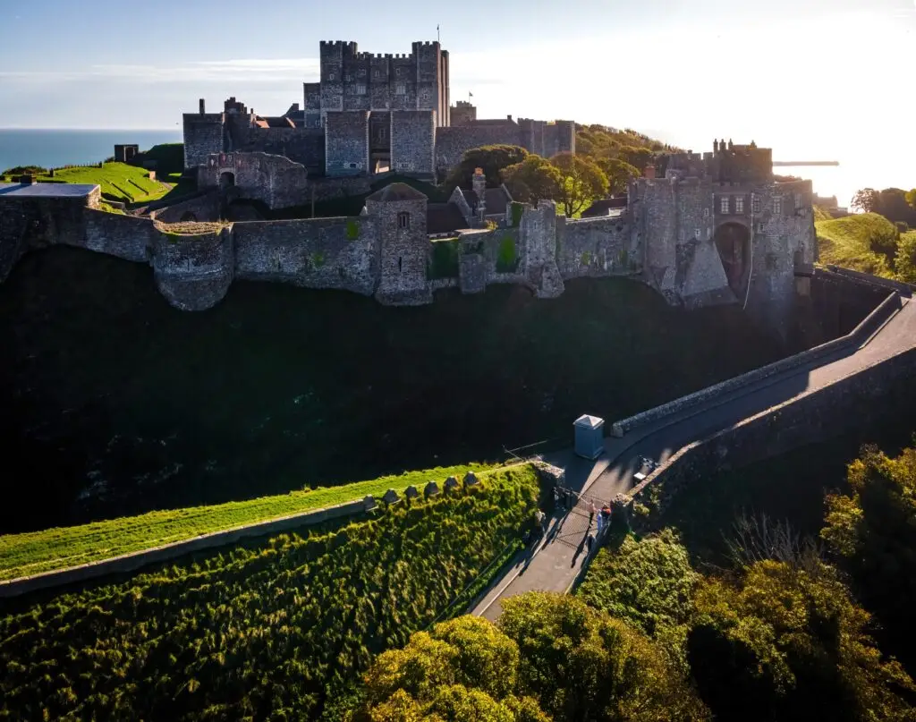 Aerial view of Dover Castle in Dover, England, overlooking the coastline and historic fortifications, popular tourist attraction in the United Kingdom