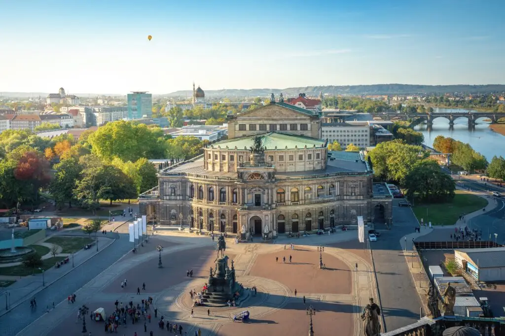 Aerial view of Theaterplatz and Semperoper Opera House in Dresden Germany with cityscape and Elbe River in the background