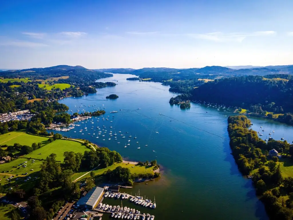 Aerial view of Windermere Lake in the Lake District, England, showcasing scenic countryside, boats, and marinas ideal for UK private tours and travel photography