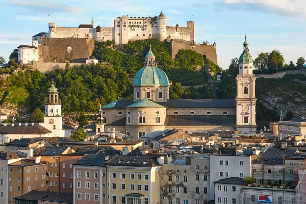Historic Hohensalzburg Fortress and Salzburg Cathedral overlooking the old town cityscape in Salzburg, Austria