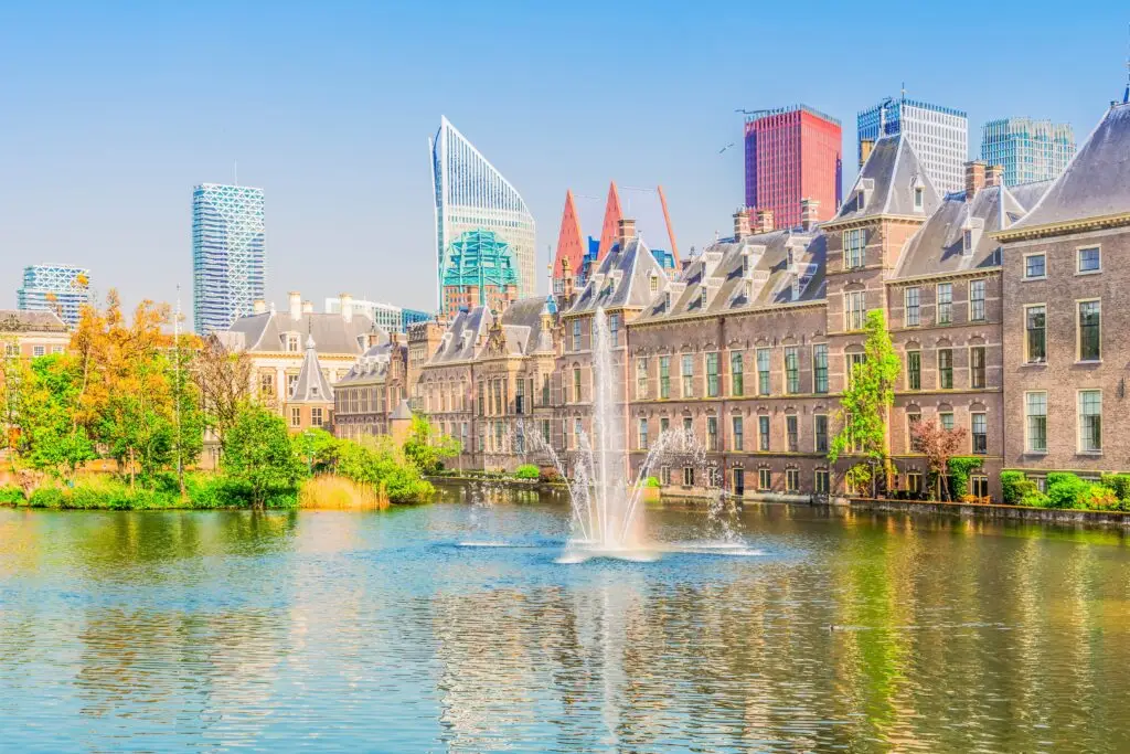 View of the Binnenhof and Dutch Parliament buildings with fountain in The Hague, Netherlands, a popular landmark and tourist attraction in Europe