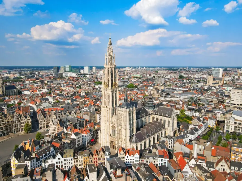 Aerial view of the Cathedral of Our Lady and historic city center in Antwerp, Belgium, showcasing medieval architecture and vibrant urban landscape