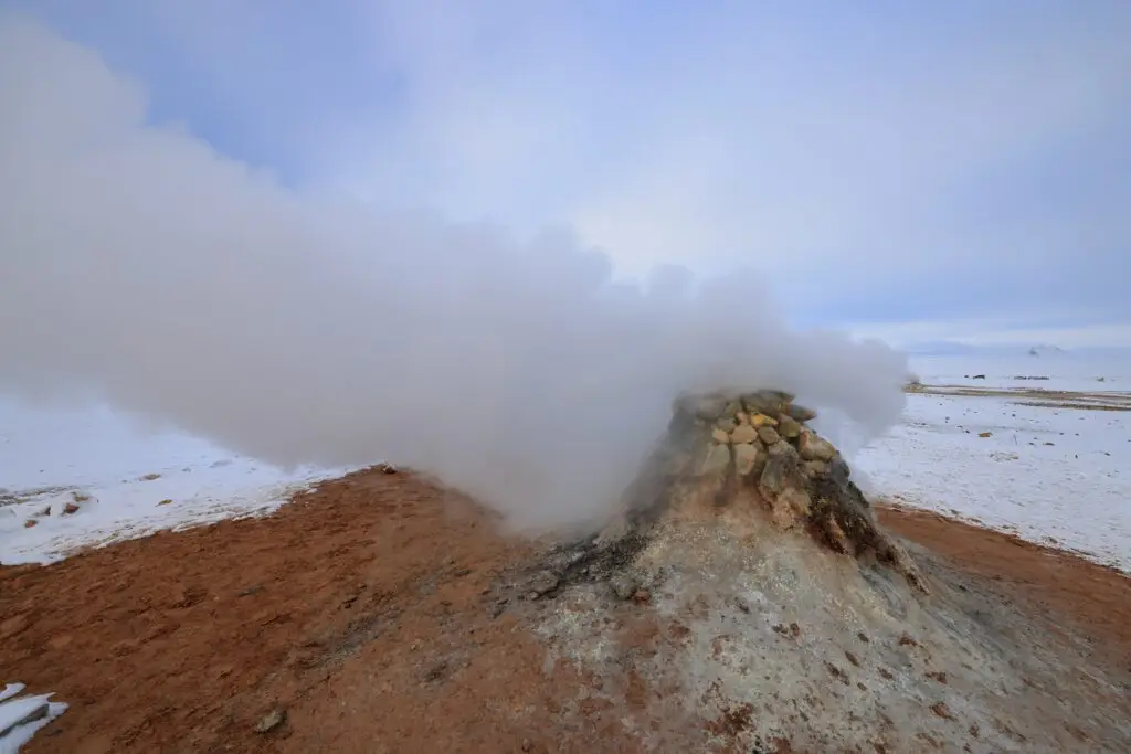 Geothermal fumarole emitting steam at Hverir geothermal area in northern Iceland, popular natural tourist attraction near Lake Myvatn
