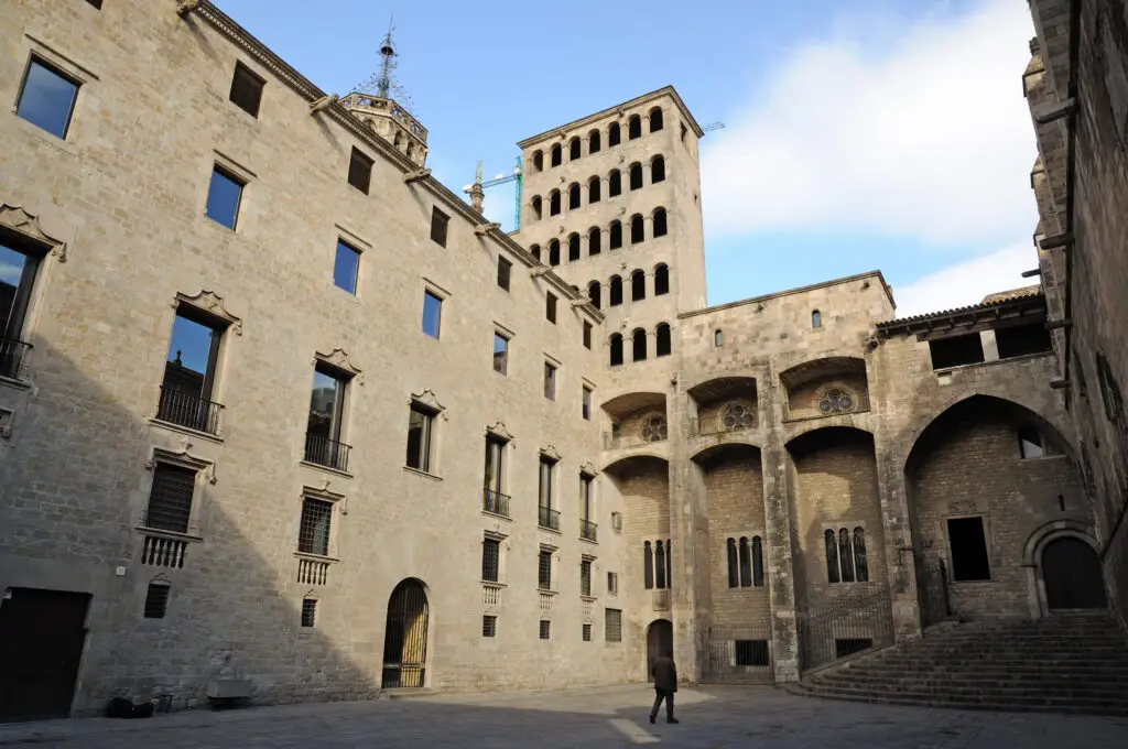 Historic medieval courtyard of Plaça del Rei in Barcelona Spain featuring ancient stone architecture and Gothic buildings in the city’s old quarter