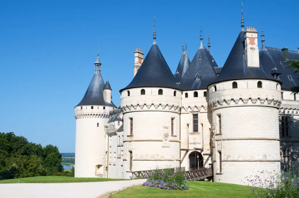 Historic Château de Chaumont-sur-Loire castle in the Loire Valley, France, with stone towers and gardens under a clear blue sky, popular tourist attraction and cultural site