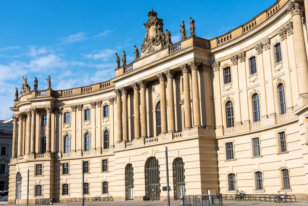 Historic baroque-style building at Bebelplatz in Berlin Germany under a bright blue sky, popular sightseeing spot on private city tours